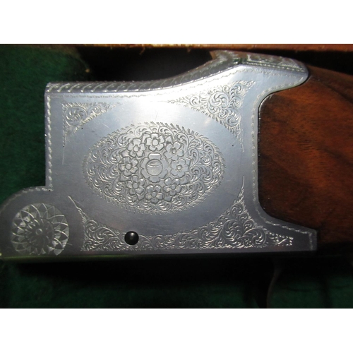 333 - Cased Laurona over and under double barrelled double trigger shotgun, engraved metalwork to body, ba... 