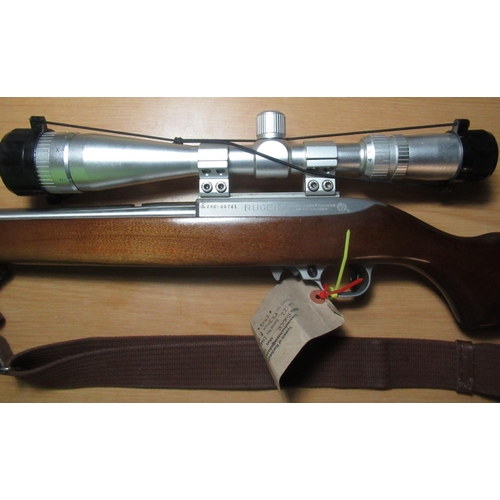 405 - Ruger model 10/22  .22 carbine rifle, fitted with Tasco scope and leather rifle sling with 2x  boxed... 