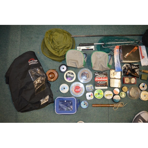 94 - Large collection of fishing equipment, Fly and monofilament line, landing nets, an Isusu Charger ree... 