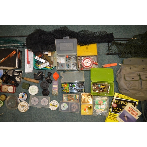 94 - Large collection of fishing equipment, Fly and monofilament line, landing nets, an Isusu Charger ree... 