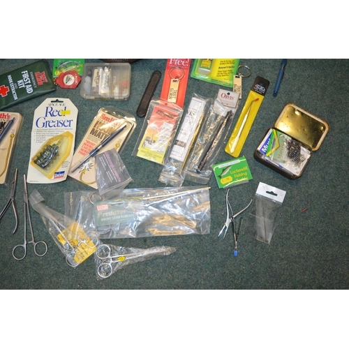 95 - Brown leather case filled with fishing equipment including hook sharpeners, fishing glue, pliers, fo... 