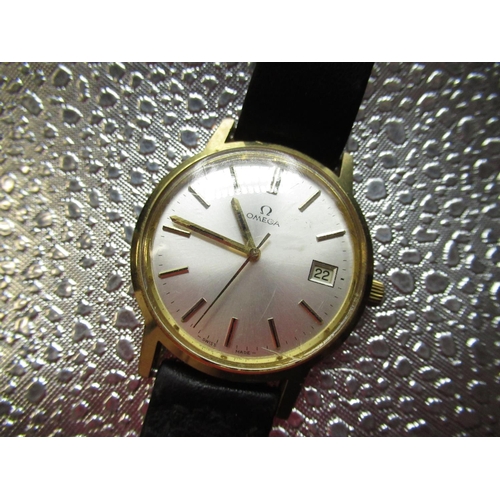 324 - 1970's Omega gold plated hand wound wristwatch, with date, silvered dial with applied indices and ce... 