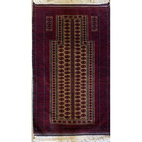 546 - Afghan red ground wool rug with central beige ground field set with multiple geometric floral motifs... 