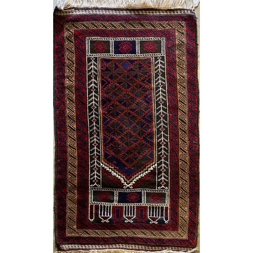 547 - Kayam red and antque gold ground wool rug with central field and stylised alternating geometric patt... 