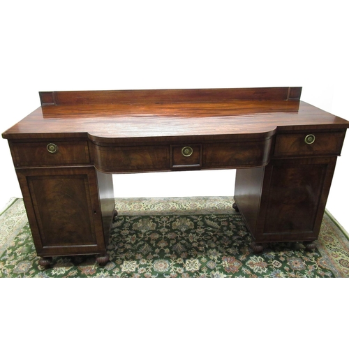 554 - Regency mahogany bow breakfront pedestal sideboard, three frieze drawers with brass ring handles, on... 