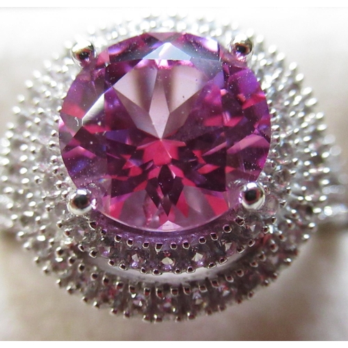 63 - 14ct white gold pink sapphire and diamond halo style ring