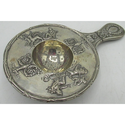 78 - Dutch silver tea strainer with chariots, urns and flowers in relief decoration, 2.44ozt