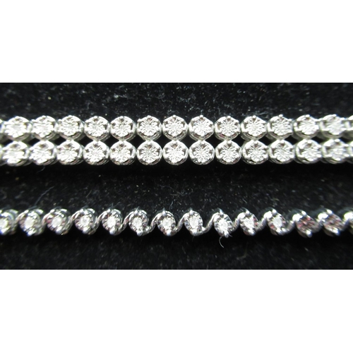 15 - C21st silver and diamond  bracelet, two rows of diamonds inset in sterling silver circular mounts wi... 