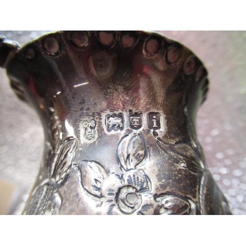 80 - Edw.VII hallmarked sterling silver milk jug with repousse flowers and scrolls by C S Harris & Sons L... 