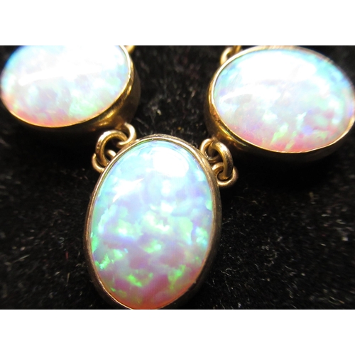 1 - 9ct yellow gold and opal necklace, nine graduated oval opal beads inset in linked 9ct yellow gold mo... 