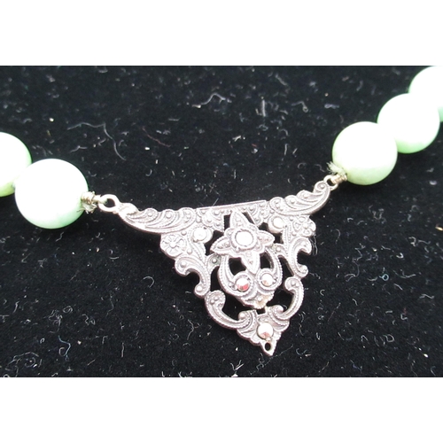 2 - Jade bead necklace, single string with  marcasite set white metal central decoration and marcasite s... 