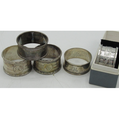 96 - Matched pair of Geo.V hallmarked sterling silver napkin rings with engine turned decoration initiall... 