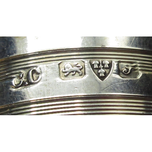 96 - Matched pair of Geo.V hallmarked sterling silver napkin rings with engine turned decoration initiall... 