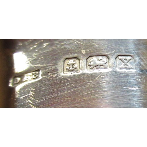 97 - Pair of Geo.V hallmarked sterling silver napkin rings with repousse wreath and initialled R, by Dock... 