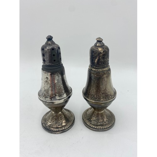 99 - Pair of silver plated salt and pepper mills with weighted bases, stamped Dutch Creation (2)