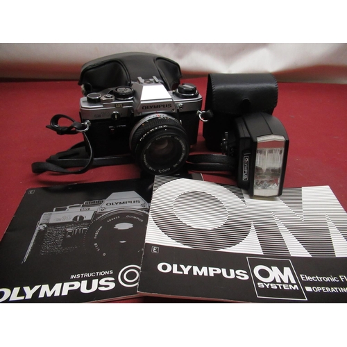 1206 - Olympus OM10 camera with 50mm lens and Olympus T20 flashgun in grey carry bag