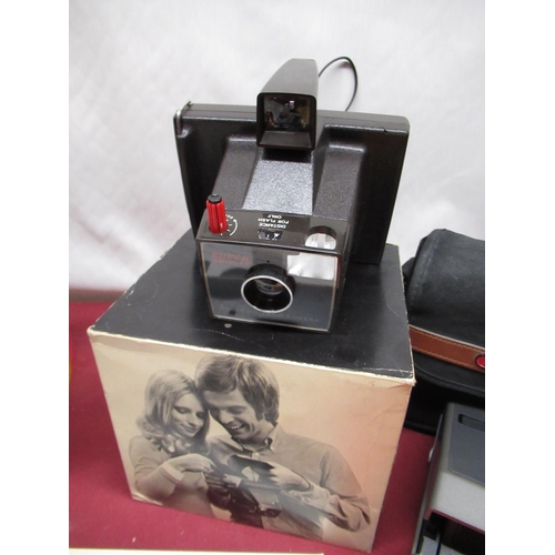 1212 - Two boxed Polaroid Super Swinger cameras, Polaroid Image camera, selection of various photographic p... 