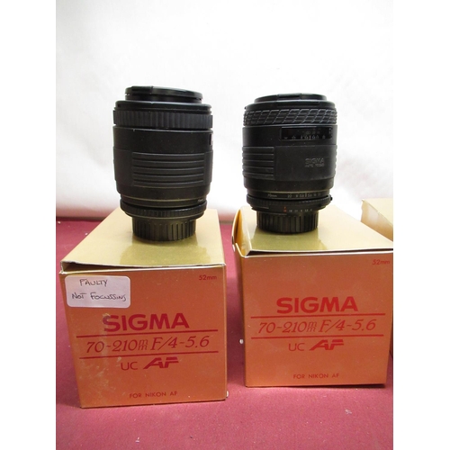 1197 - Nikon auto focus Sigma lenses, including two 70-210mm lenses (one A/F), 50mm F2.8 macro lens and a  ... 