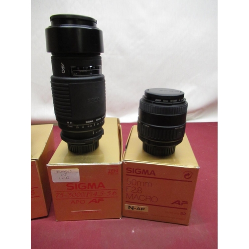 1197 - Nikon auto focus Sigma lenses, including two 70-210mm lenses (one A/F), 50mm F2.8 macro lens and a  ... 