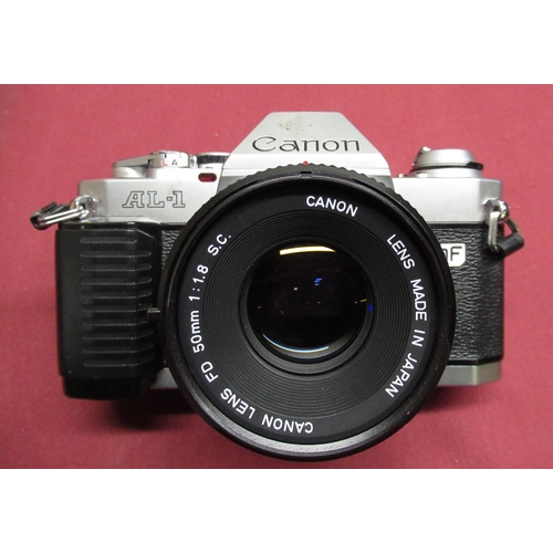 1198 - Canon AL-1 SLR camera with Canon 50mm F1.8 lens, Canon 35-70mm lens, Vivitar 70-150mm lens, power wi... 