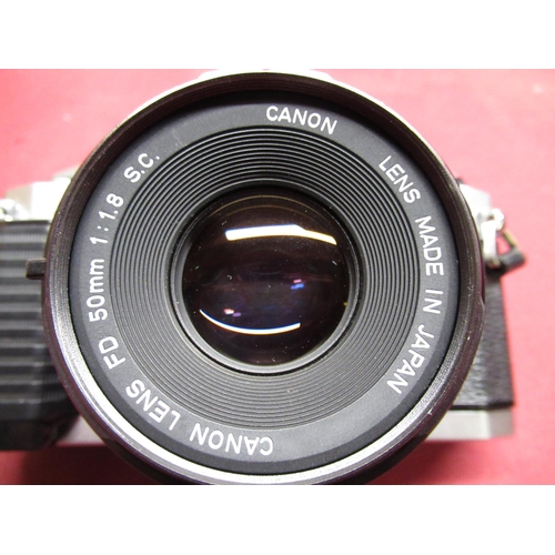 1198 - Canon AL-1 SLR camera with Canon 50mm F1.8 lens, Canon 35-70mm lens, Vivitar 70-150mm lens, power wi... 