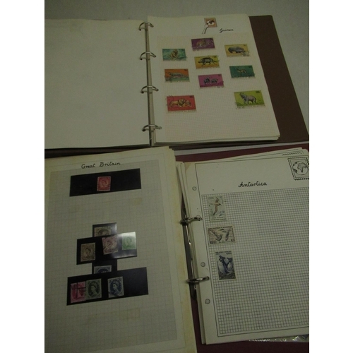 1165 - Stanley Gibbons International stamp album containing world stamps and another containing British and... 