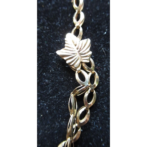 8 - 9ct yellow gold link chain necklace, double layer and maple leaf decoration with spring ring clasp a... 
