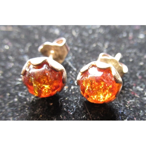 9 - Pair of drop pendant faceted amber earrings, with 14ct gold mounts stamped 585, L4cm, a faceted ambe... 