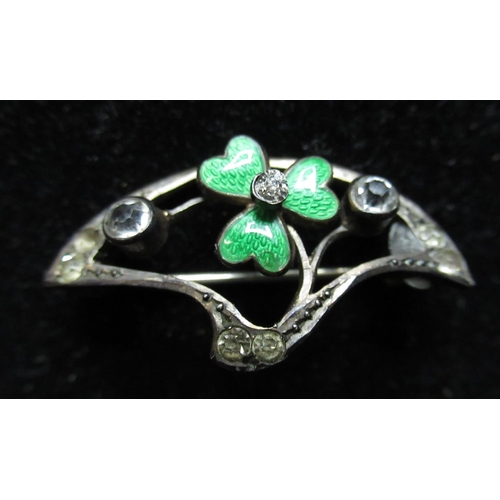 29 - 9ct yellow gold openwork brooch with a green enamel clover with white stone center and an Art Nouvea... 