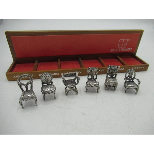 90 - Set of six continental sterling silver miniature period chairs with a small display shelf 1.83ozt