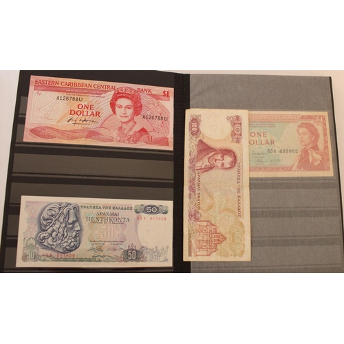 719 - collection of UK, commonwealth and world banknotes in two albums, (all pages photographed)