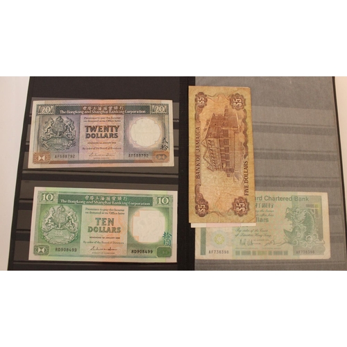 719 - collection of UK, commonwealth and world banknotes in two albums, (all pages photographed)