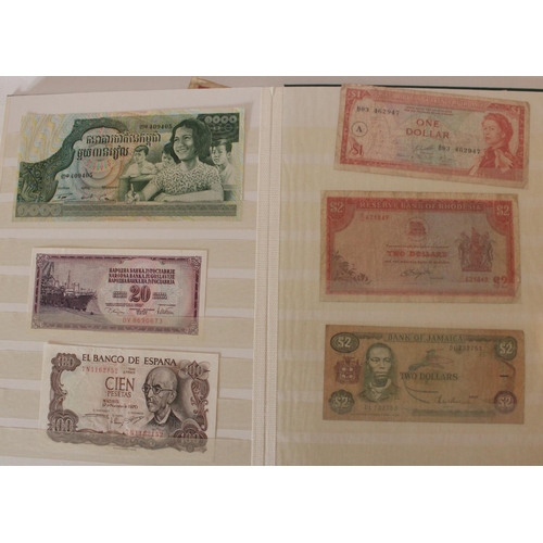 719 - collection of UK, commonwealth and world banknotes in two albums, (all pages photographed)