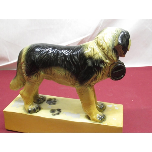 324 - Mid C20th Neundorf Cognac Hennessy figure of a St. Bernard, H26cm L30cm