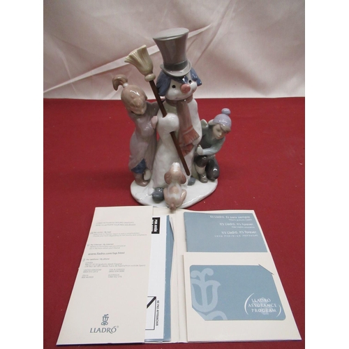 300 - Lladro figure group of a Snowman and two children, with certificate