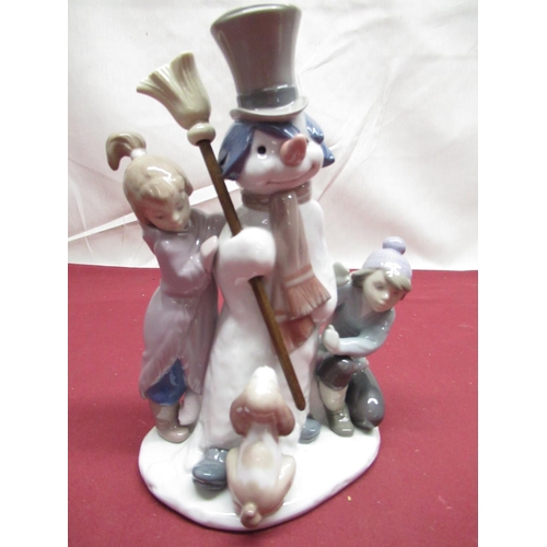 300 - Lladro figure group of a Snowman and two children, with certificate