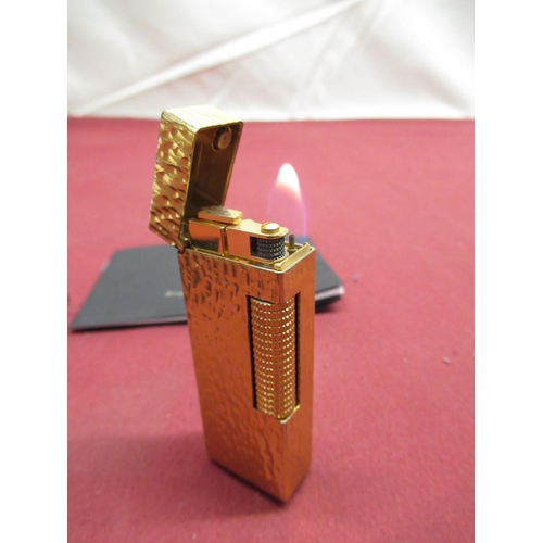 148 - Late 1970s Dunhill Rollagas gold plated butane lighter with bark effect case, with bag and Dunhill R... 