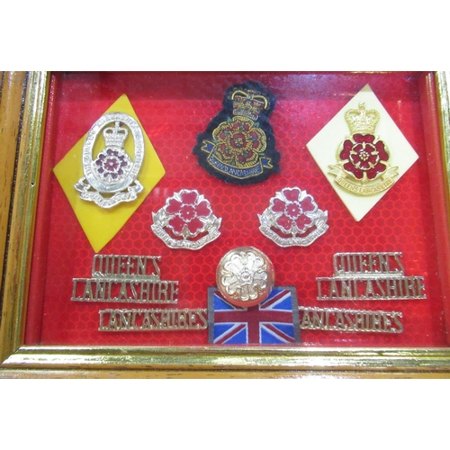 331 - Framed and mounted display of Queen's Lancashire regimental insignia, mostly Staybrite, similar fram... 