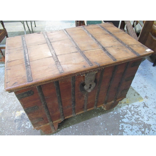 741 - C20th Anglo Indian iron banded hardwood dowry chest, on four legs with wheels, W104CM, D66CM, H76CM