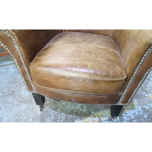 746 - C20th brown leather tub chair, H87cm