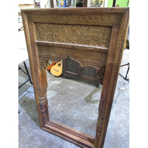 747 - C20th Indian hardwood framed mirror, carved in relief with scrollwork and foliage, H136cm, W79cm