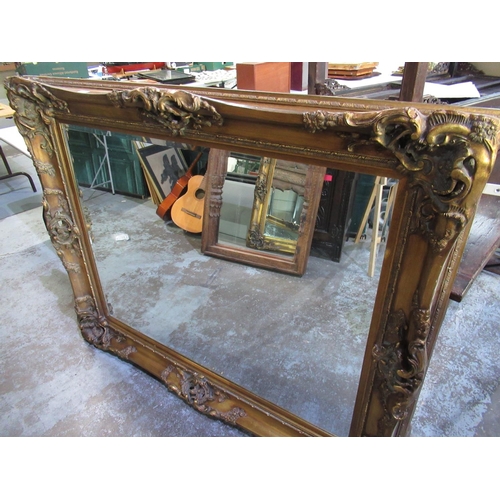 749 - Large gilt framed rococo style mirror, W150cm, H120cm