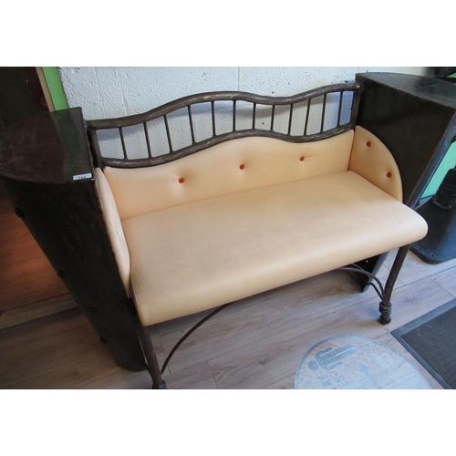 750 - C20th designer love-seat formed of cut cast iron barrel sides with inset glass cabochon prunts and b... 