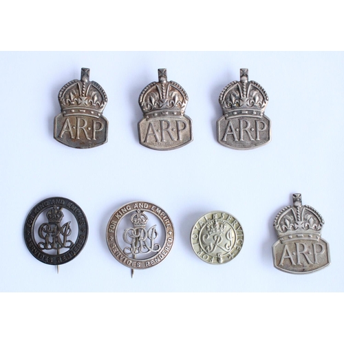 250 - Four hallmarked silevr ARP badges, two King and Empire Services Rendered badges and a Loyal Service ... 