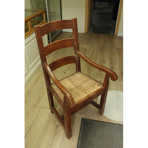 740 - Set of six C20th solid oak ladder back dining chairs with rush seats including two matching carvers ... 