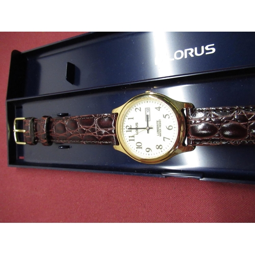 450 - As new Lorus Lumibrite quartz wristwatch with day date, gold plated case on brown leather strap, wat... 