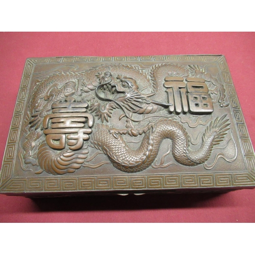 326 - Early C20th Chinese bronzed jewellery box, hinged lid decorated in relief with dragon, surrounded by... 