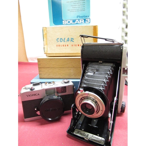 327 - Minolta X-700 camera, with 50mm F1.7 lens, Sigma 70 - 250 lens, various filters, metal camera case a... 