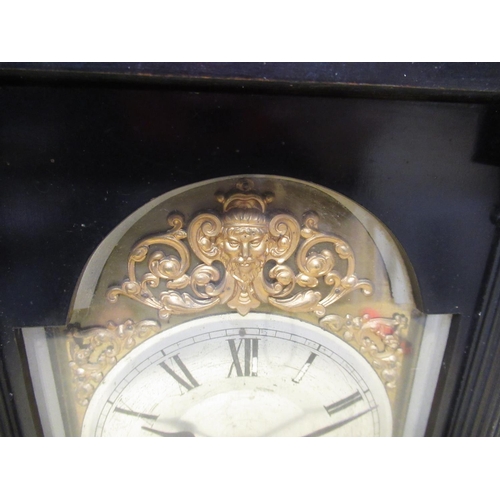 333 - Late C19th continental mantel clock, ebonised style case on rectangular stepped base brake arch dial... 