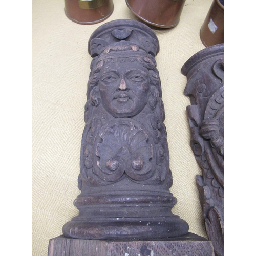 343 - Pair of C19th oak fire surround corbel with carved relief decoration of a male and female facemask, ... 